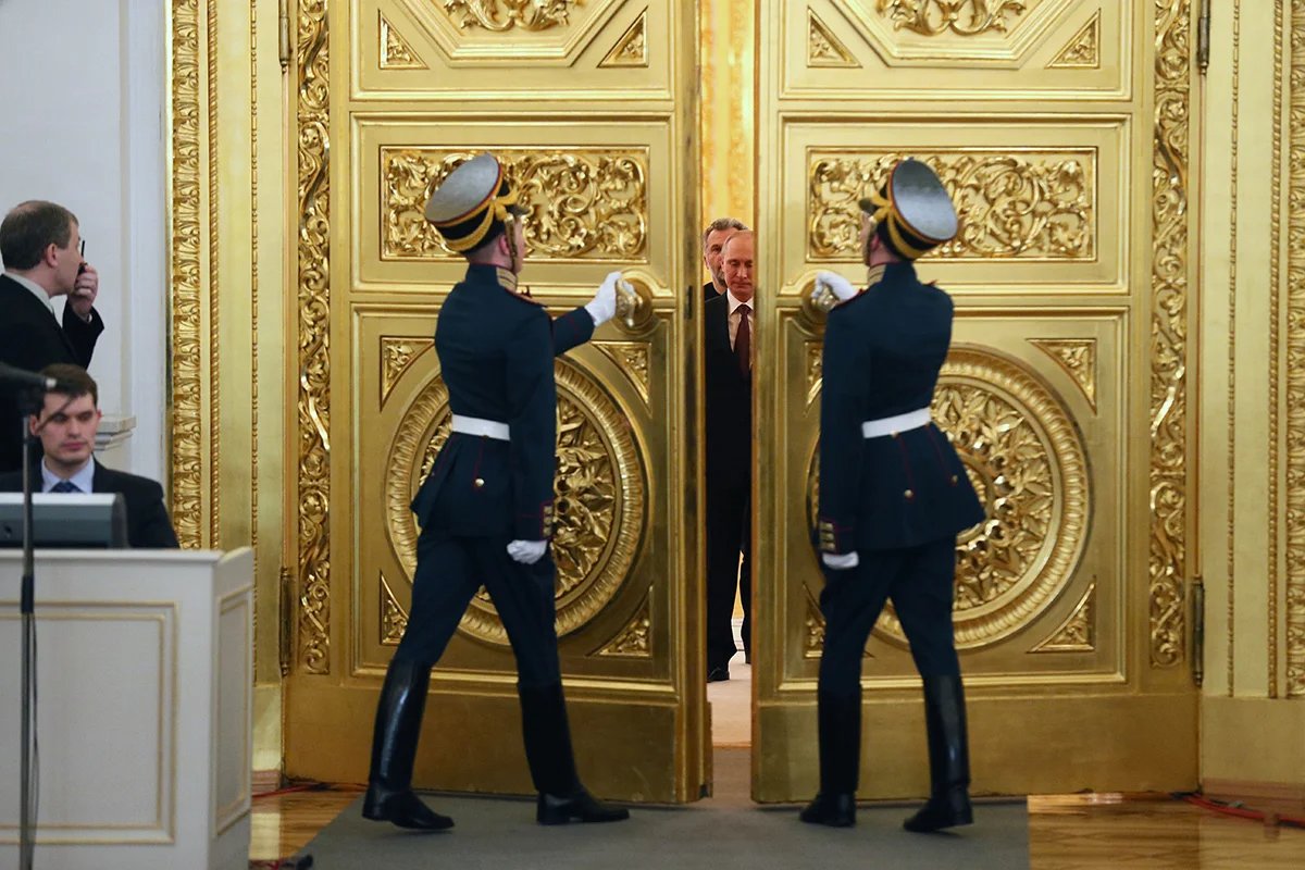 Vladimir Putin arrives to sign a treaty on Crimea’s “reunification” with Russia in the Kremlin, 18 March 2014. Photo: EPA/SERGEI ILNITSKY